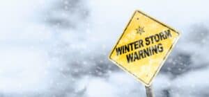 Winter Storm Warning Sign With Snowfall and Stormy Background Winter Storm Warning Sign With Snowfall and Stormy Background
