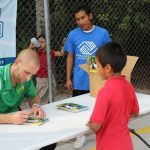 Tampa Bay Rowdies player Keith Savage signs autographs at the Bonita Springs soccer clinic.