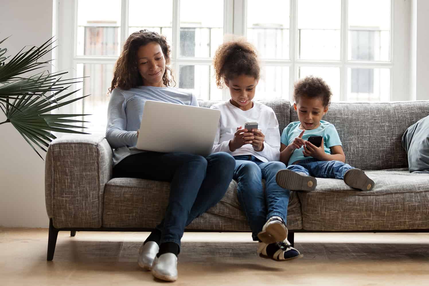 Mother and kid on electronics