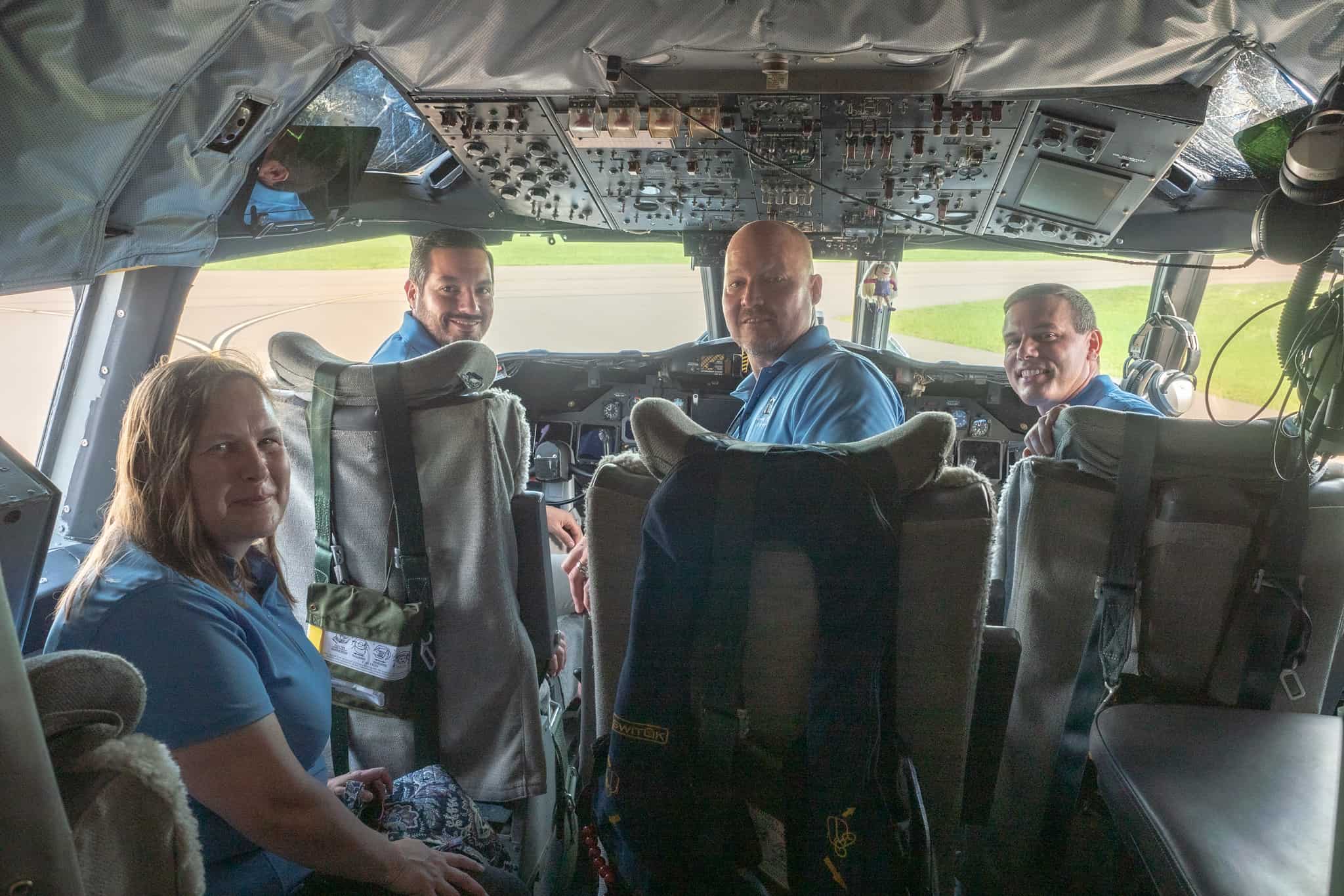 Members of the Tower Hill Claims team on the flight deck of “Miss Piggy.”