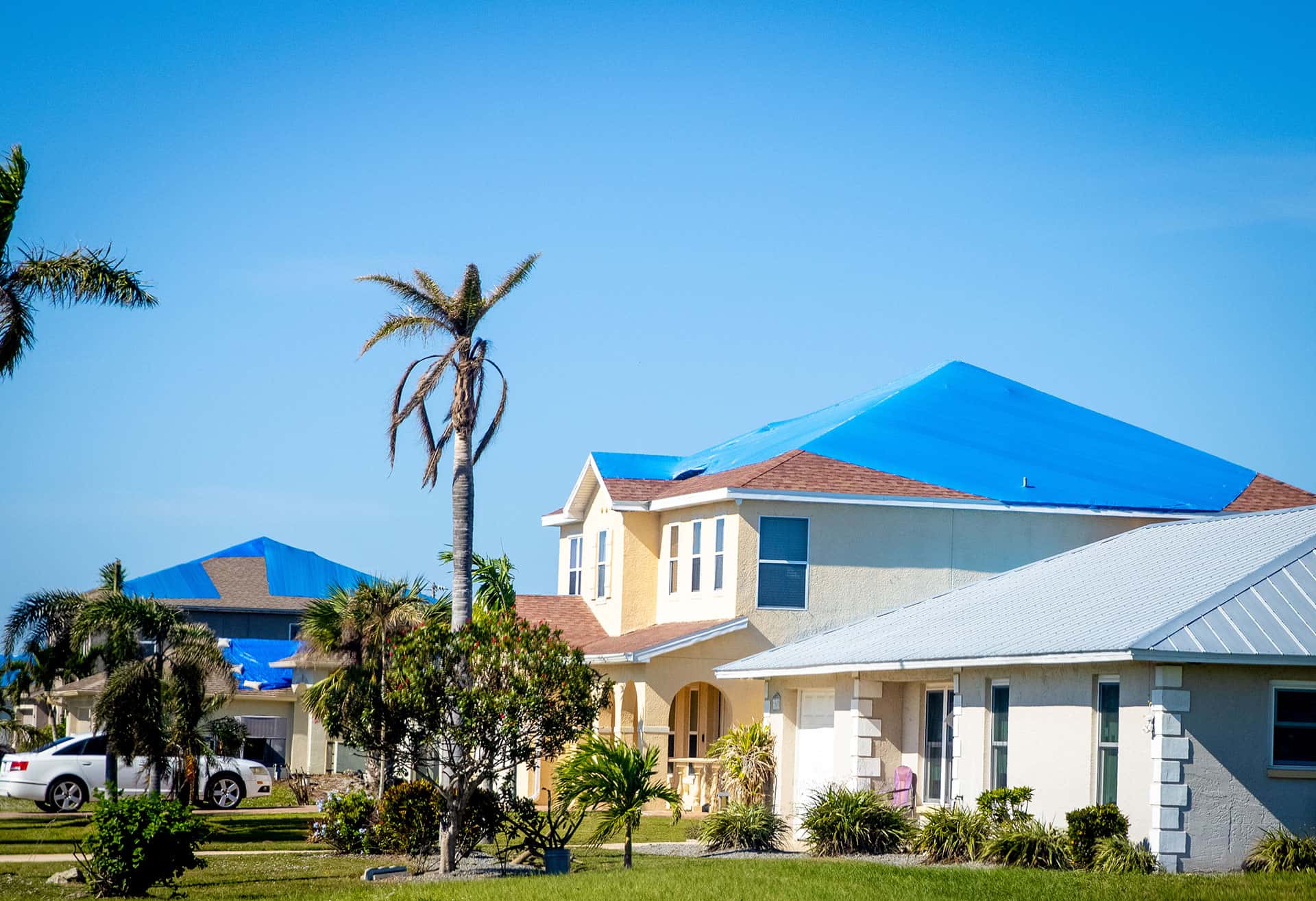 Home with tarped roof