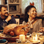 Group of friends around thanksgiving dinner table