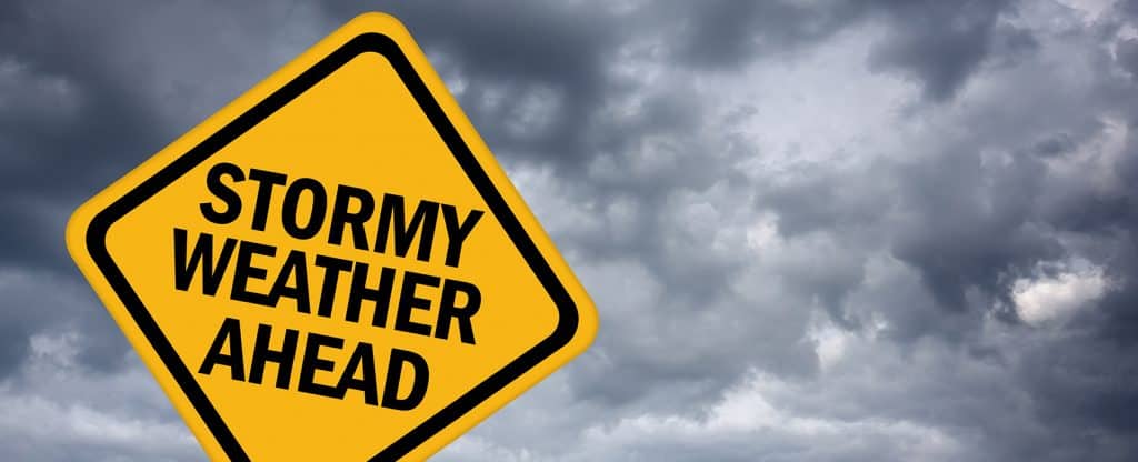 Street sign reading "Stormy Weather Ahead"